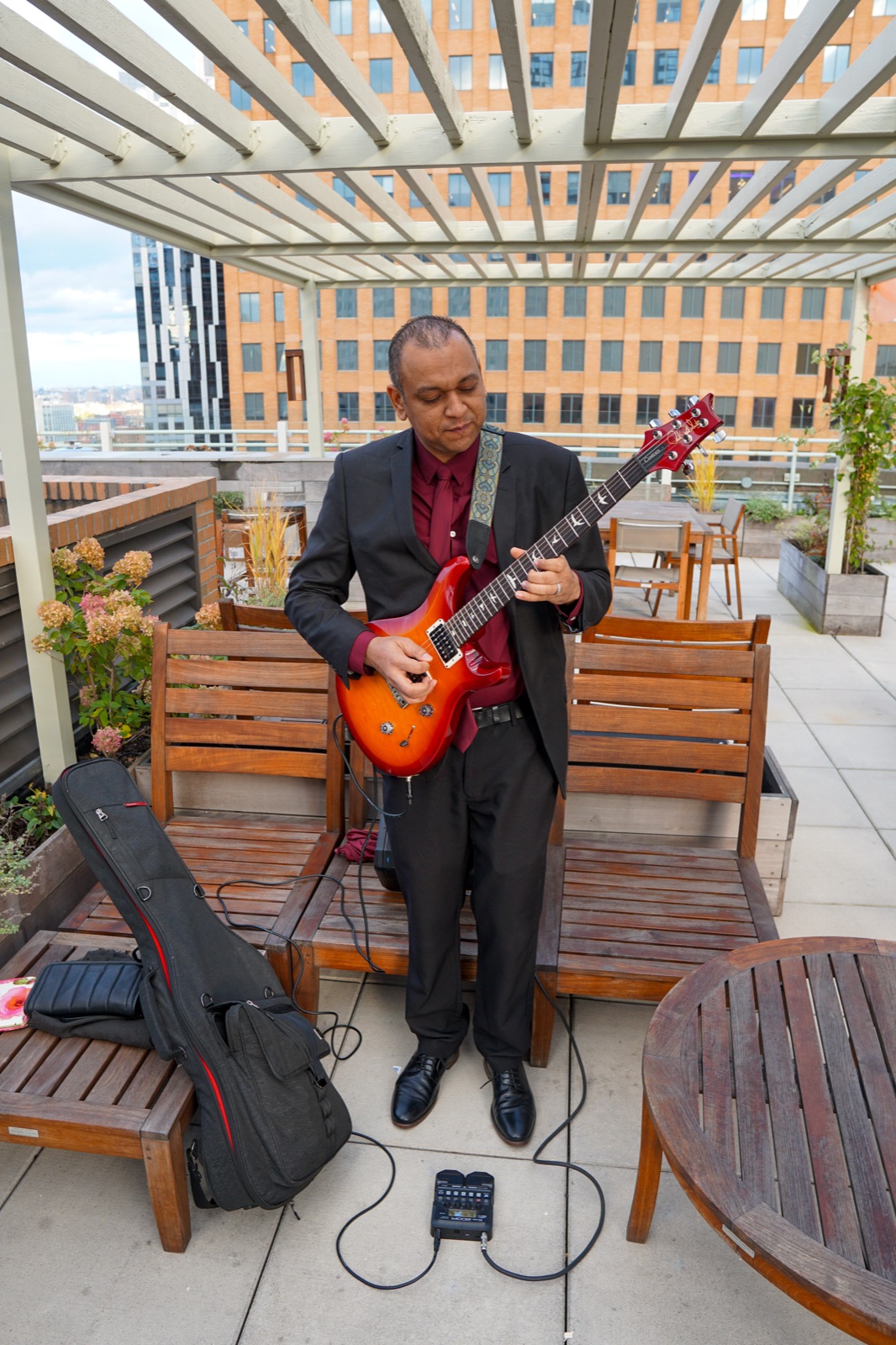 Live bassist performing on the rooftop
