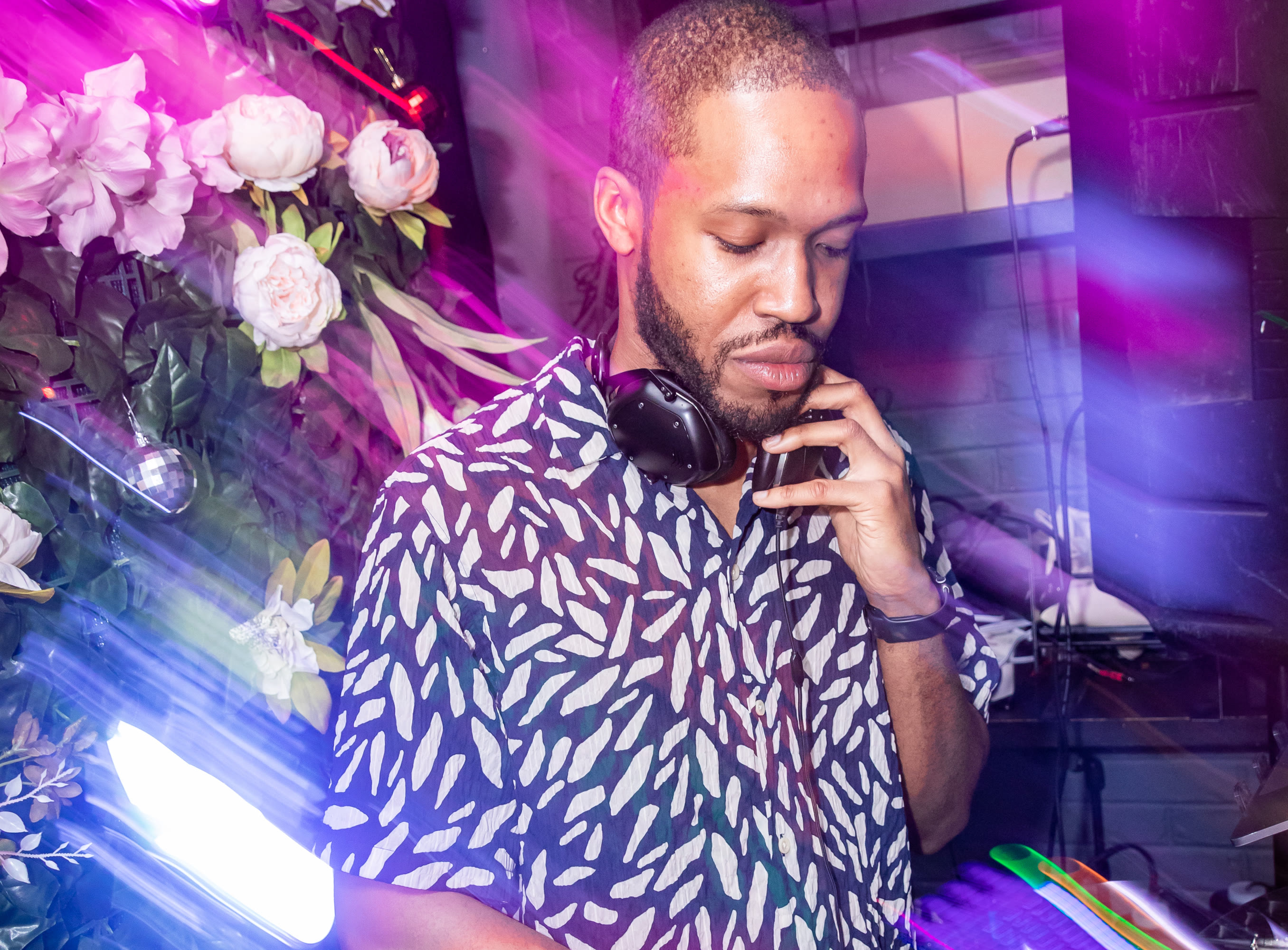 Justin Harmond mixing under neon lights