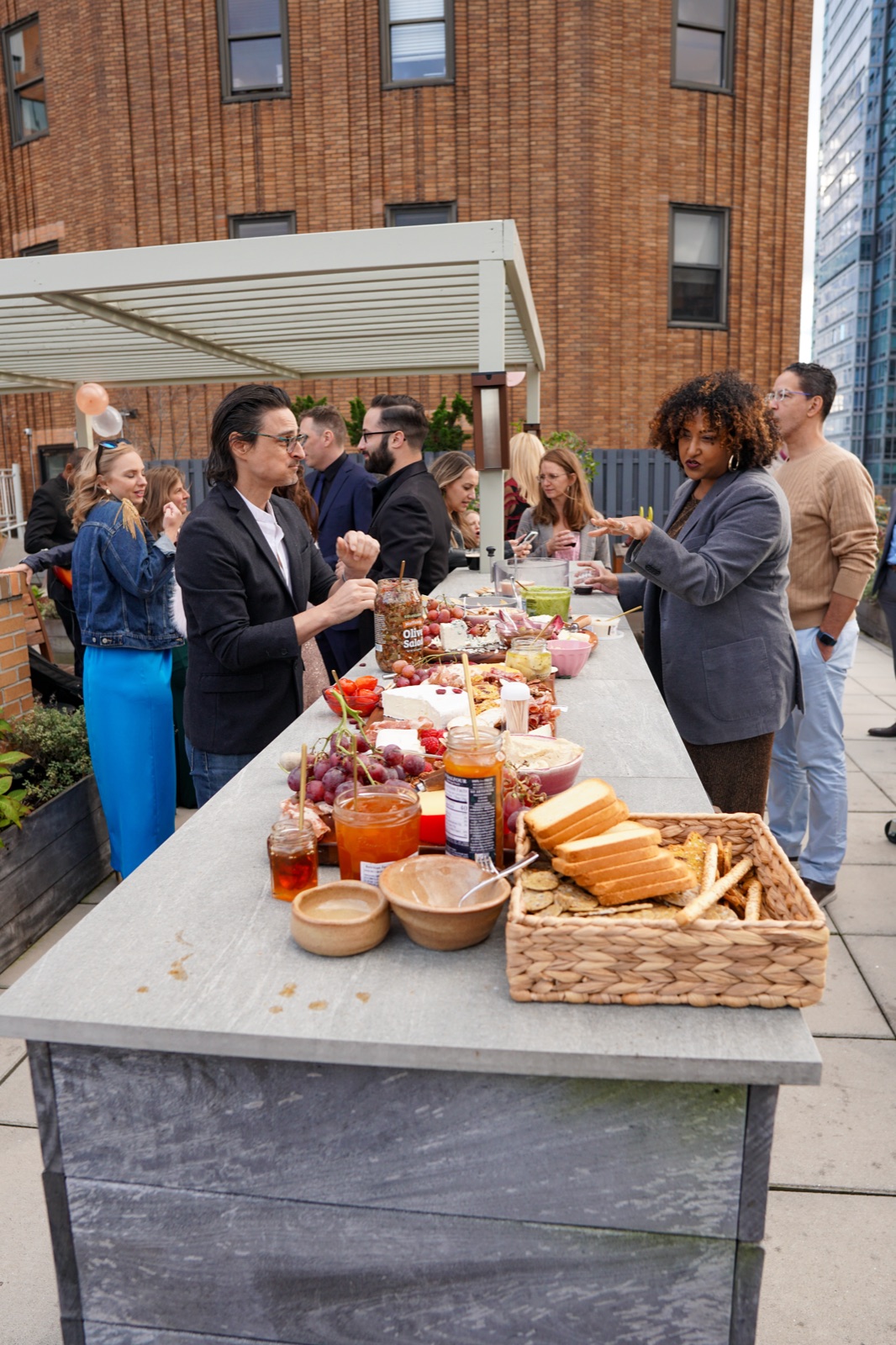 Charcuterie and food spread set up for a rooftop party